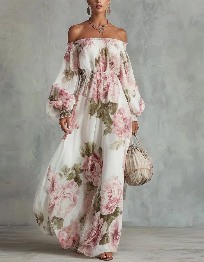 White chiffon maxi dress with pink rose print and off-shoulder design