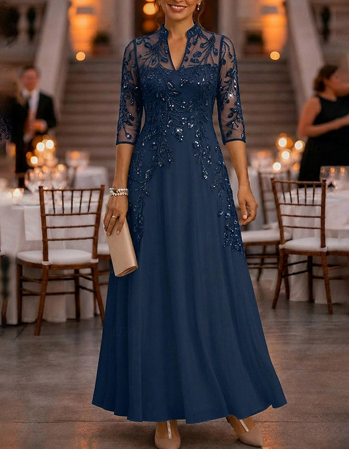 Champagne-colored maxi dress made of chiffon and mesh with golden sequins, floral print, and 3/4 sleeves