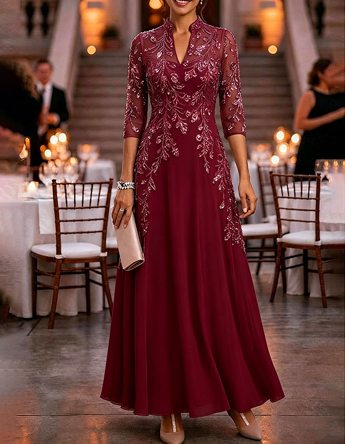 Champagne-colored maxi dress made of chiffon and mesh with golden sequins, floral print, and 3/4 sleeves
