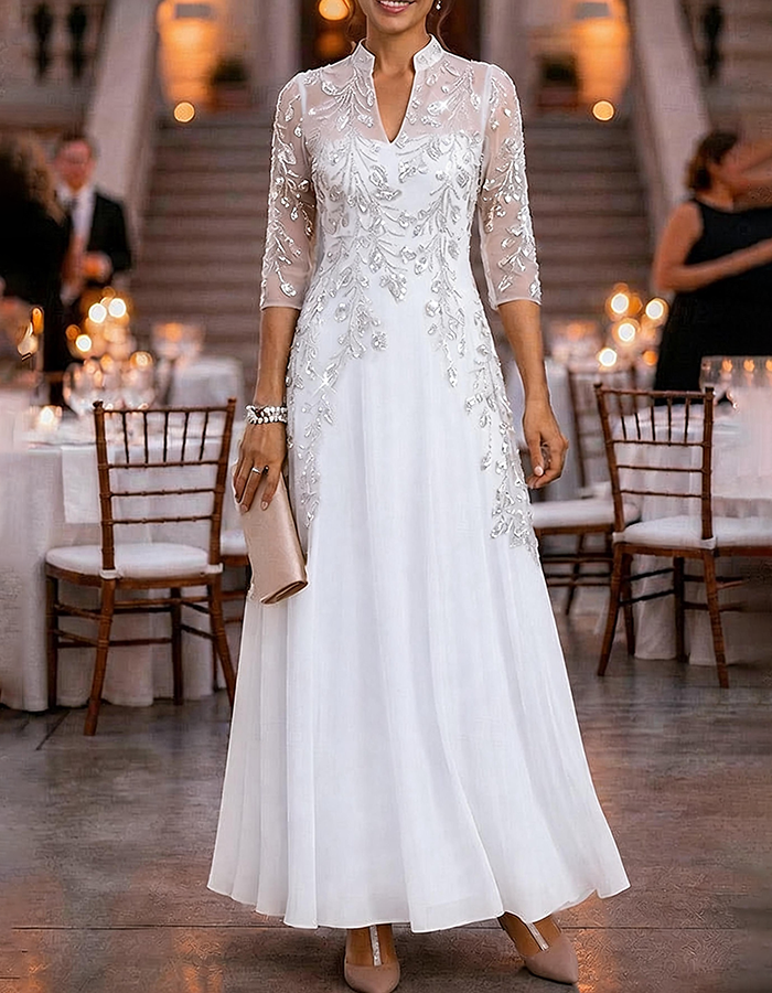 Champagne-colored maxi dress made of chiffon and mesh with golden sequins, floral print, and 3/4 sleeves
