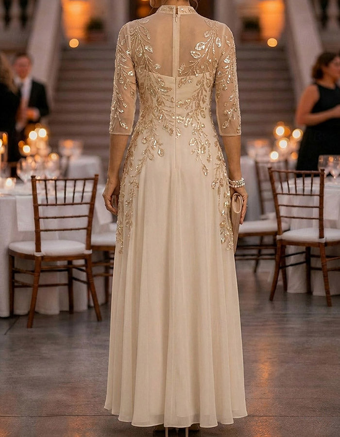Champagne-colored maxi dress made of chiffon and mesh with golden sequins, floral print, and 3/4 sleeves