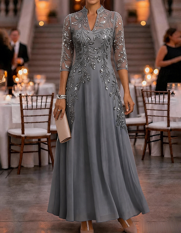 Champagne-colored maxi dress made of chiffon and mesh with golden sequins, floral print, and 3/4 sleeves