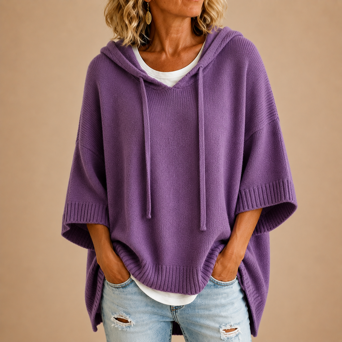 Oriana knitted poncho, styled with straight trousers