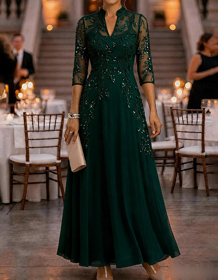 Champagne-colored maxi dress made of chiffon and mesh with golden sequins, floral print, and 3/4 sleeves