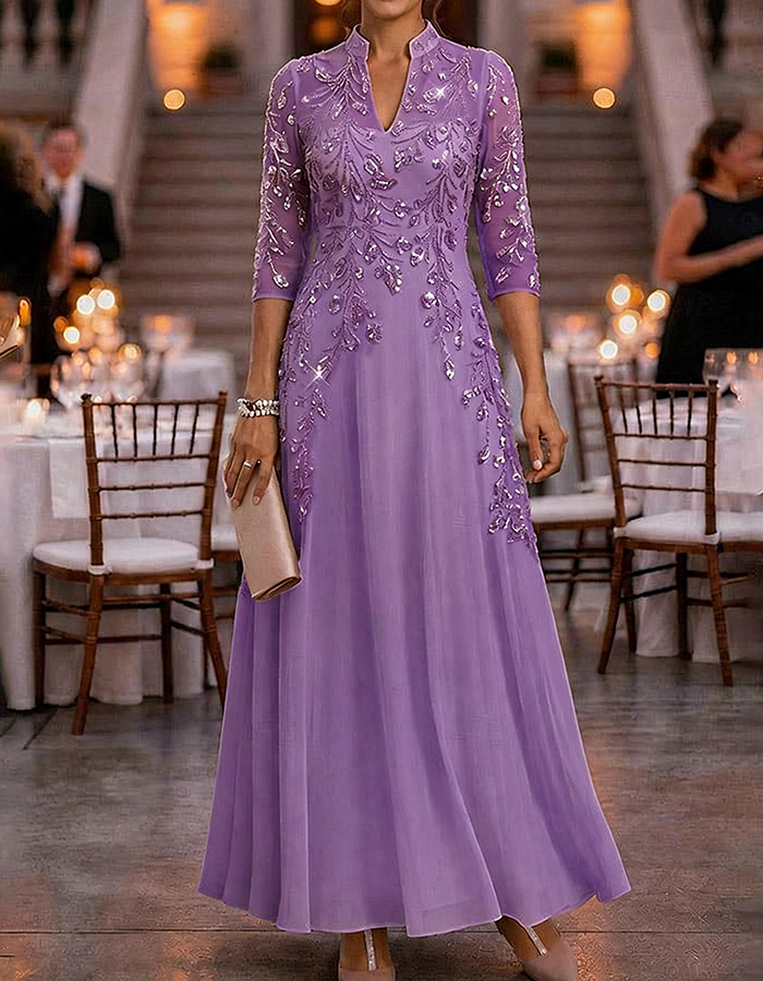 Champagne-colored maxi dress made of chiffon and mesh with golden sequins, floral print, and 3/4 sleeves